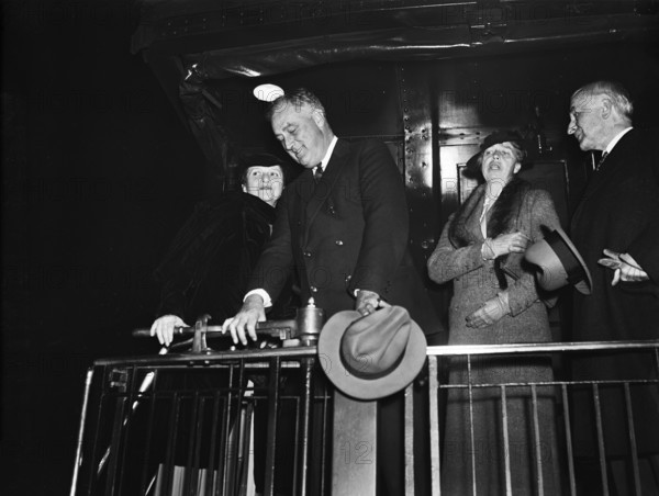 U.S. Secretary of Labor Frances Perkins (left), U.S. President Franklin Roosevelt (2nd left), U.S. First Lady Eleanor Roosevelt (2nd right), aboard train departing for Warm Springs, Georgia, Washington, D.C., USA, Harris & Ewing, 1935