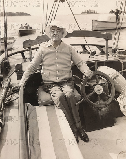 US. President Franklin D. Roosevelt at wheel of Amberjack II while sailing from Marion, Massachusetts, USA  to Campobello, New Brunswick, Canada, Franklin D. Roosevelt Presidential Library & Museum, June 16, 1933`