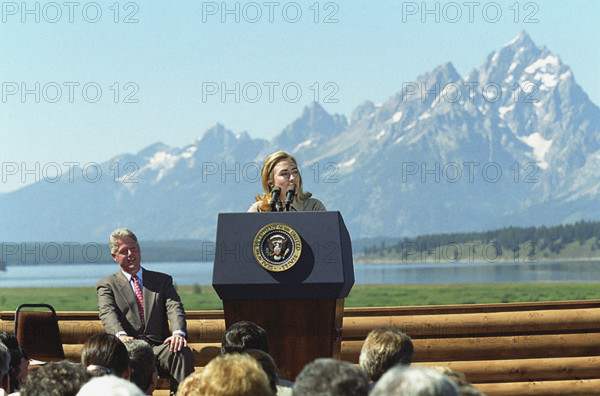 U.S. First Lady Hillary Rodham Clinton delivering remarks, as U.S. President Bill Clinton looks on,  at event marking 75th anniversary of Women's Suffrage, Jackson, Wyoming, USA, Bob McNeely, White House Photograph Office, August 26, 1995