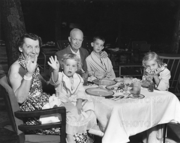 U.S. President Dwight D. Eisenhower and U.S. First Lady Mamie Eisenhower spending weekend vacation at Camp David with their grandchildren, Left to right: Mamie Eisenhower holding Susan, Dwight D. Eisenhower, David, and Anne, Frederick County, Maryland, USA, U.S. Navy Photo, July 30, 1954