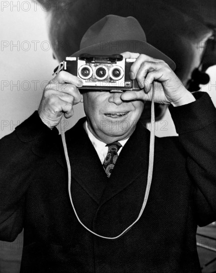 U.S. President Dwight D. Eisenhower photographing his photographers at the airport prior to his departure for Augusta, Georgia, National Airport, Washington, DC., USA, 
Abbie Rowe, White House Photographs, December 25, 1953