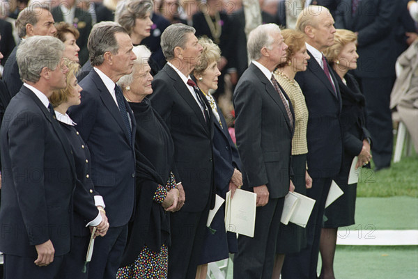 U.S. President Bill Clinton and U.S. First Lady Hillary Rodham Clinton (both far left) attending funeral of former U.S. President Richard Nixon with former U.S. Presidents (l-r) George H.W. Bush, Ronald Reagan, Jimmy Carter, Gerald Ford and former U.S. First Ladies (l-r) Barbara Bush, Nancy Reagan, Rosalynn Carter, Betty Ford, Yorba Linda, California, USA, Barbara Kinney, White House Photograph Office, April 27, 1994