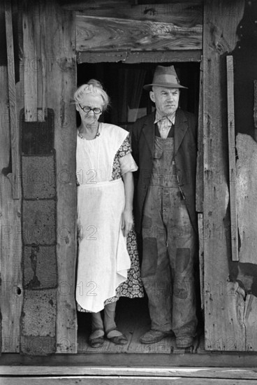 Mr. and Mrs. John Landers, tenant farmers, at backdoor of their farmhouse, near Marseilles, Illinois, USA, Russell Lee, U.S. Farm Security Administration, January 1937