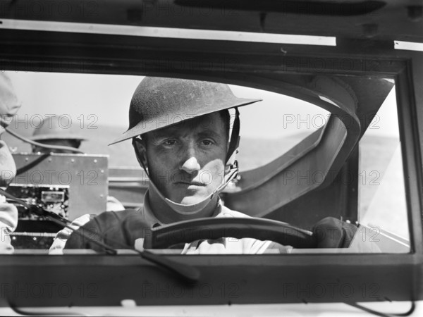 Driver of scout car of a mechanized cavalry reconnaissance unit, Fort Riley, Kansas, USA, Jack Delano, U.S. Office of War Information, April 1942