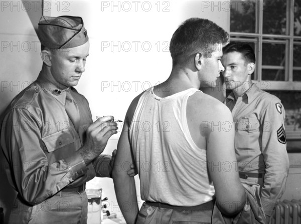 George Camblair getting his injections at reception center, Fort Belvoir, Virginia, USA, Jack Delano, U.S. Office of War Information, September 1942