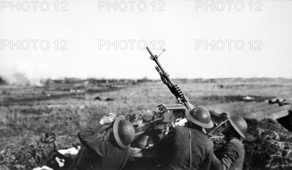 Anti-aircraft machine gun of 101st Field Artillery (formerly 1st Massachusetts Field Artillery, New England Coast Artillery), firing on a German observation plane, Plateau Chemin des Dames, France, U.S. Army Signal Corps, March 1918