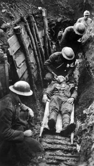 U.S. marine receiving first aid before being sent to hospital in rear of trenches. Toulon Sector, France, U.S. Army Signal Corps, March 22, 1918