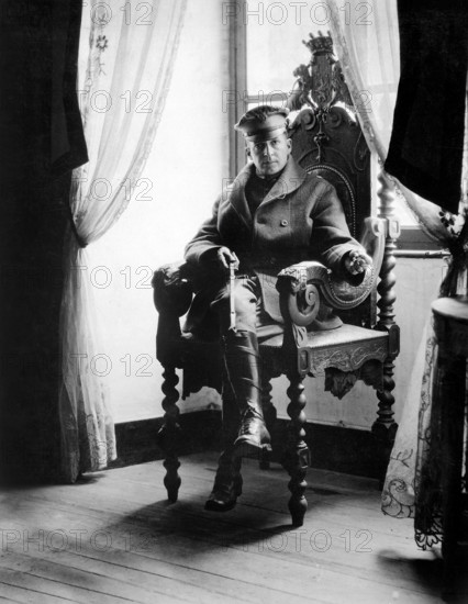 U.S. Brigadier General Douglas MacArthur, seated in the original chair of the old lord of the chateau, cleaned up after the Germans left and restored what he could of the original splendor, Chateau Saint-Benoit, Montagne, France, U.S. Army Signal Corps, September 19, 1918