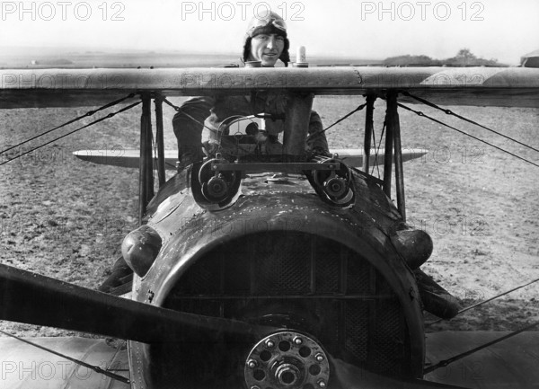 First Lieutenant E. V. "Eddie" Rickenbacker, 94th Aero Squadron, American ace, standing up in his Spad plane, near Rembercourt, France, U.S. Army Signal Corps, October 1918