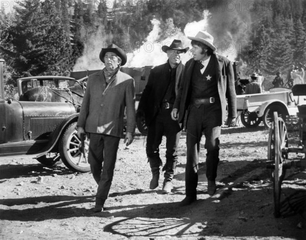 Robert Mitchum, George Kennedy, Dick Peabody, on-set of the western film, "The Good Guys And The Bad Guys", Warner Bros.-Seven Arts, 1969