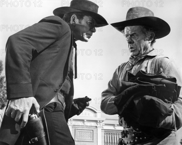 Claude Akins, Elisha Cook, Jr. , on-set of the western film, "The Great Bank Robbery", Warner Bros.-Seven Arts, 1969