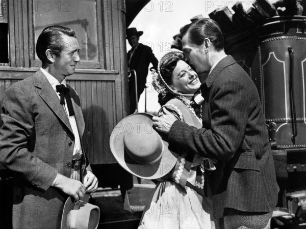 Macdonald Carey, Ellen Drew, Wendell Corey, on-set of the western film, "The Great Missouri Raid", Paramount Pictures, 1951