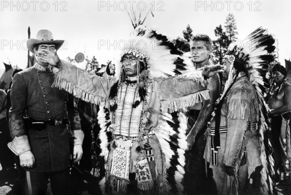 Glenn Strange (standing left, Confederate officer), John War Cloud, Jeff Chandler (2nd right, background), on-set of the western film, "The Great Sioux Uprising", Universal Pictures, 1953