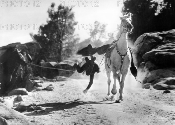 Ken Maynard, on-set of the western film, "Gun Justice", Universal Pictures, 1933