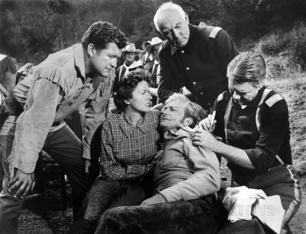 Dennis Morgan, Paula Raymond, Richard Denning, Roy Gordon, on-set of the western film, "The Gun That Won The West", Columbia Pictures, 1955