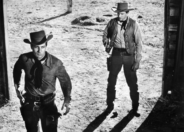 Michael Emmet (left), James Arness (right), on-set of the western film, "Gun The Man Down", United Artists, 1956