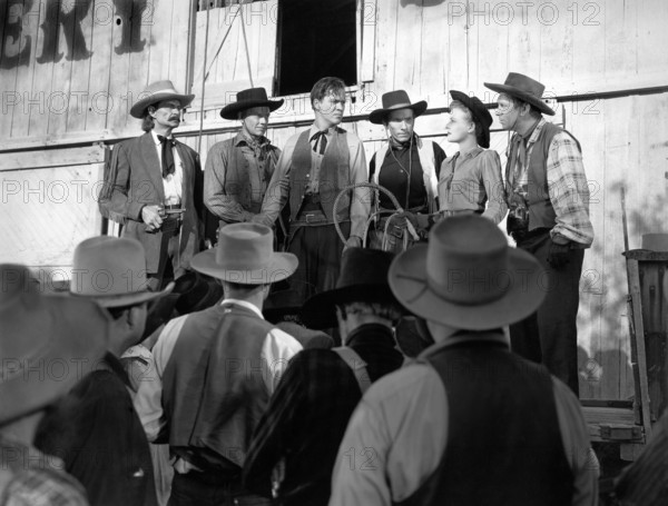 Jack Tornek, Kirby Grant, Dan White, Louise Curry, Fuzzy Knight, on-set of the western film, "Gun Town", Universal Pictures, 1946