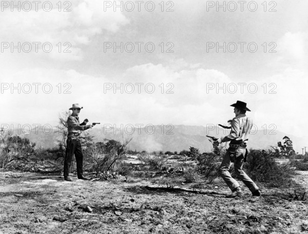 Randolph Scott, Forrest Tucker, on-set of the western film, "Gunfighters", Columbia Pictures, 1947