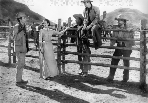 James Darren (left), Kathryn Grant, Bert Convy (sitting on fence), on-set of the western film, "Gunman's Walk", Columbia Pictures, 1958