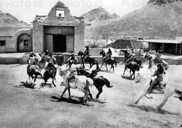 Apache fighters on horseback attacking a mission, on-set of the western film, "The Guns Of Fort Petticoat", Columbia Pictures, 1957