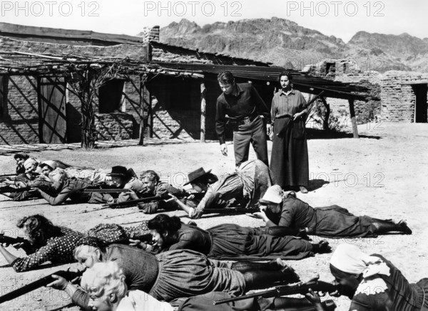 Audie Murphy, Hope Emerson (both standing rear), Peggy Maley (foreground), on-set of the western film, "The Guns Of Fort Petticoat", Columbia Pictures, 1957