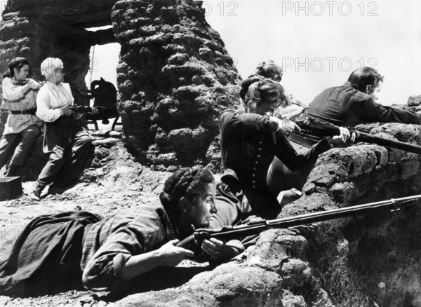 Hope Emerson (on ground, foreground), Audie Murphy (leaning right), on-set of the western film, "The Guns Of Fort Petticoat", Columbia Pictures, 1957