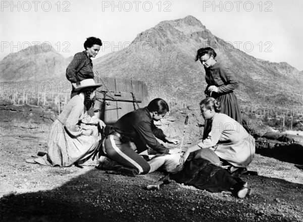 Audie Murphy (on knees, center), on-set of the western film, "The Guns Of Fort Petticoat", Columbia Pictures, 1957