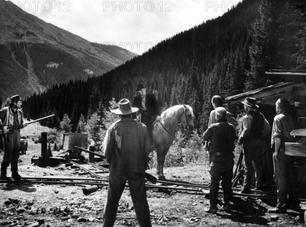 Robert Stack (on horse), on-set of the western film, "Great Day In The Morning", RKO Radio Pictures, 1956