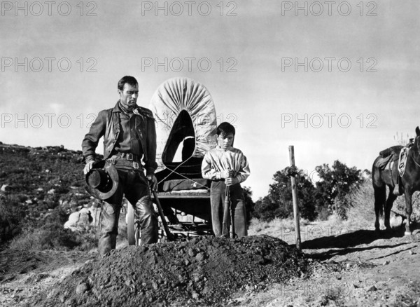 George Montgomery, Bobby Clark, on-set of the western film, "Gun Duel In Durango", United Artists, 1957