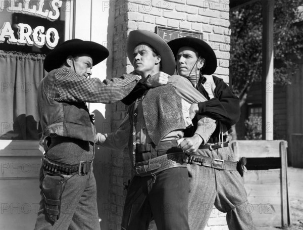 Kirby Grant (left), Fuzzy Knight (right), on-set of the western film, "Gun Town", Universal Pictures, 1946