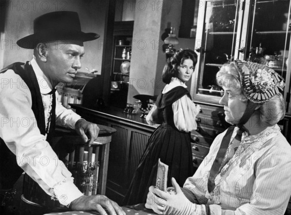 Yul Brynner (left), Janice Rule (center), Gertrude Flynn (right), on-set of the western film, "Invitation To A Gunfighter", United Artists, 1964