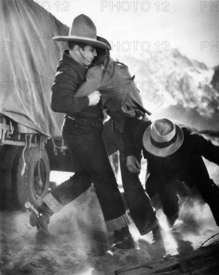 George O'Brien (left), on-set of the western film, "Hollywood Cowboy", aka "Wings Over Wyoming", RKO Radio Pictures, 1937