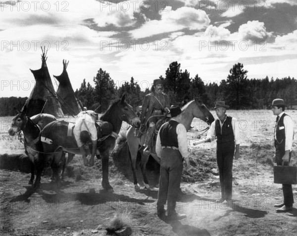 Henry Fonda (on horse), Richard Widmark (2nd right), on-set of the western film, "How The West Was Won", MGM, 1962