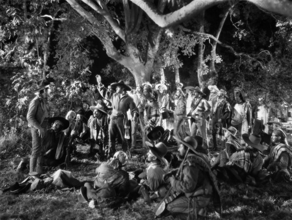 Richard Barthelmess (standing center with raised arm),  on-set of the western film, "The Lash", First National Pictures, Warner Bros., 1930