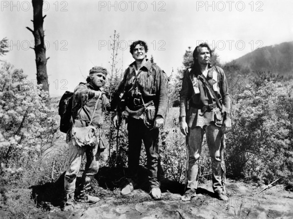 James Whitmore (left), Victor Mature (center), Pat Hogan (right), on-set of the western film, "The Last Frontier", Columbia Pictures, 1955