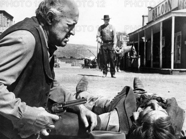 Lee J. Cobb (kneeling left), Burt Lancaster (standing center), on-set of the western film, "Lawman", United Artists, 1971