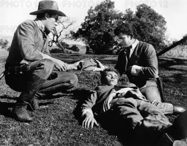 Richard Rust, Dee Pollock, Michael Landon, on-set of the western film, "The Legend Of Tom Dooley", Columbia Pictures, 1959