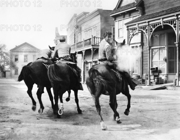 Dee Pollock, Richard Rust, Michael Landon, on-set of the western film, "The Legend Of Tom Dooley", Columbia Pictures, 1959