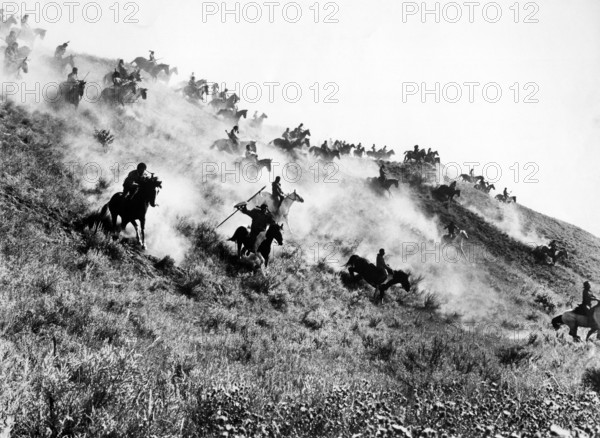 Native American fighters charging down hillside on horseback, on-set of the western  film, "Little Big Man", National General Pictures, 1970