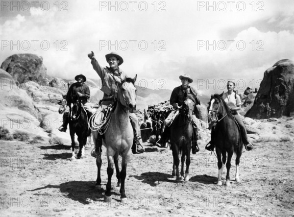 Jack Palance, Anthony Perkins, Elaine Aiken, on-set of the western film, "The Lonely Man", Paramount Pictures, 1957