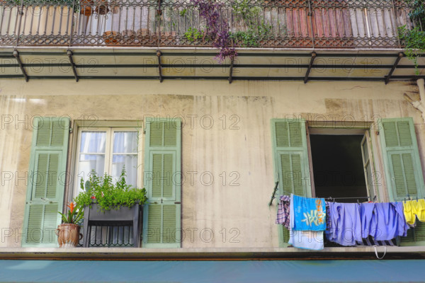 Drying laundry hanging from apartment building window