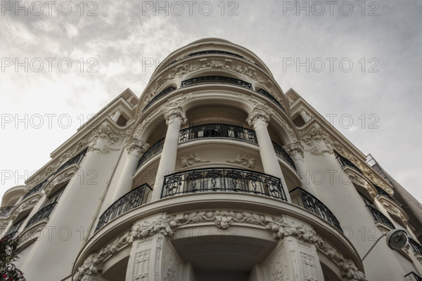 Low angle view of curved hotel balconies, Nice, France