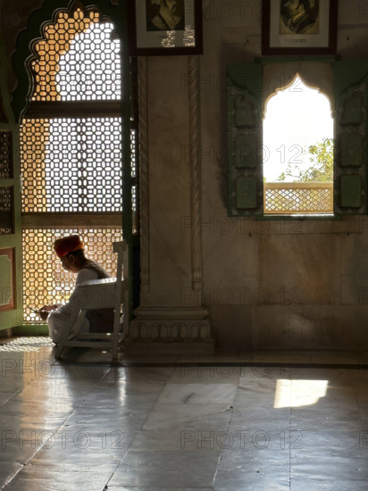 Man sitting in mosque doorway, Rajasthan, India