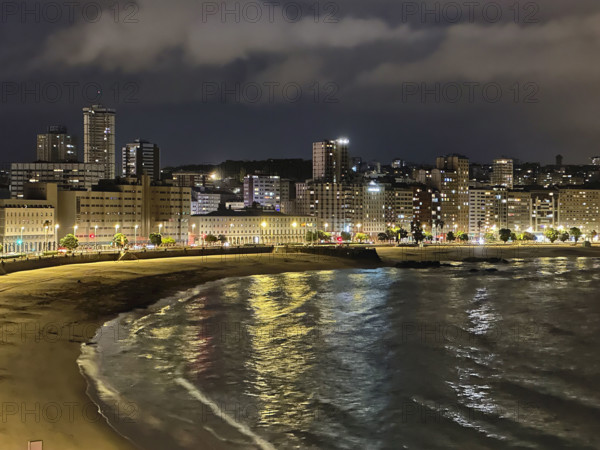 Waterfront buildings at night, A Coruña, Galicia, Spain