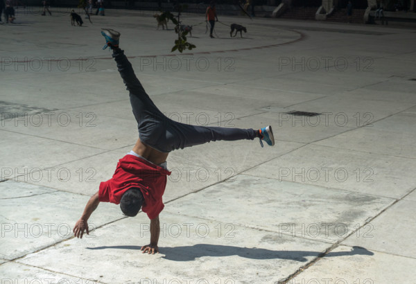 Teen boy doing handstand