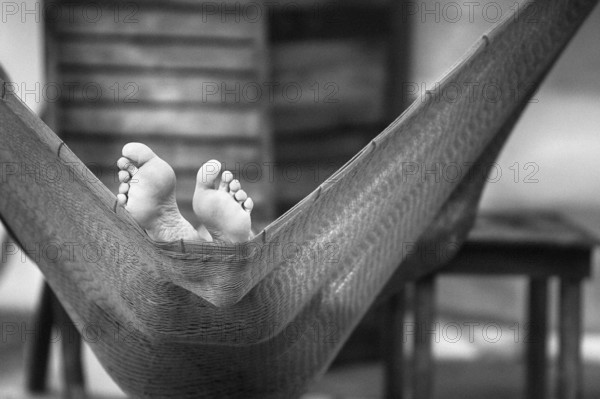 Two bare feet in hammock