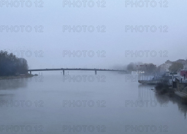 Misty river scene, near Macon, France