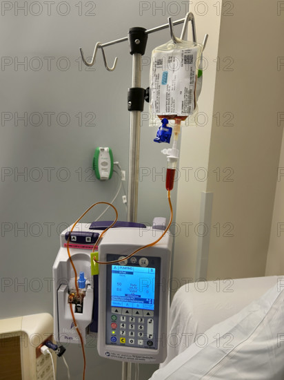 IV pump and drip apparatus in hospital room