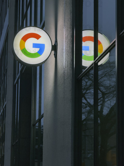 Google store at night, close-up view of illuminated company logo on building exterior, New York City, New York, USA