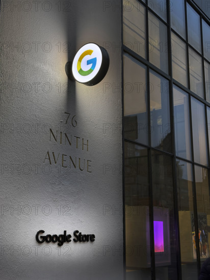 Google store at night, illuminated company logo on building exterior, New York City, New York, USA